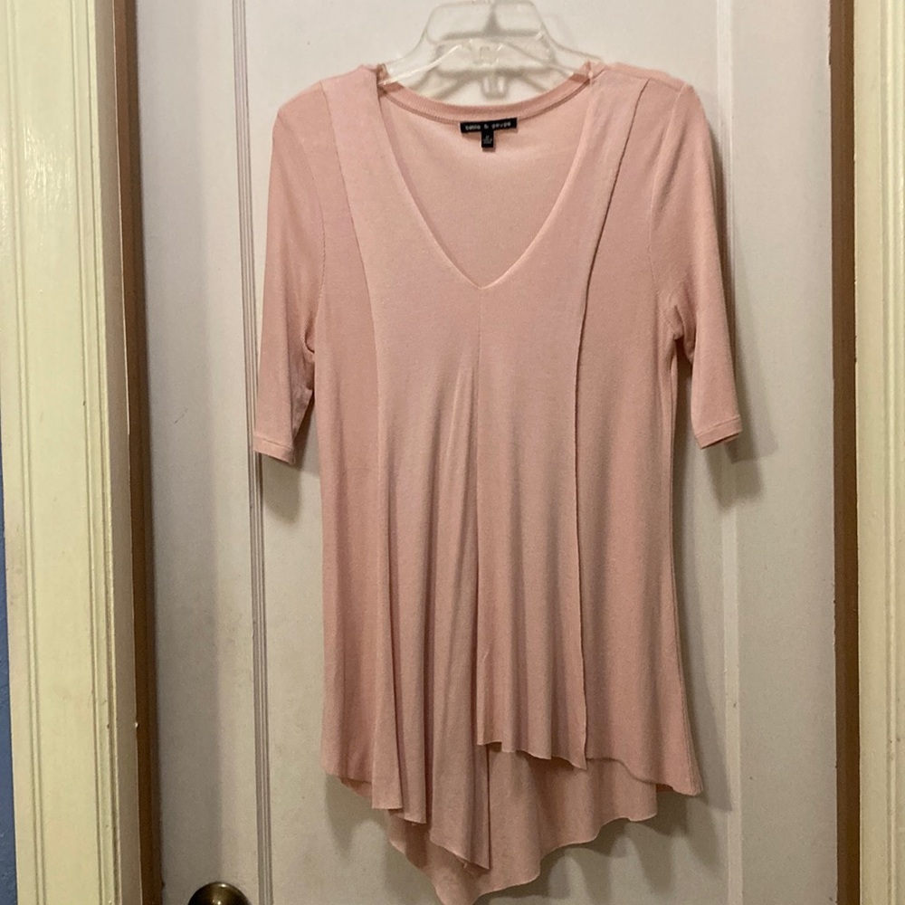 A symmetrical light sweater blouse